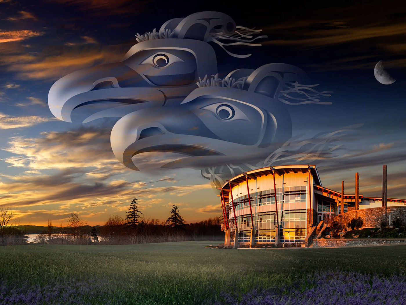 A composite photo/digital illustration of the Songhees Wellness Centre, the location of Animikii's headquarters. The building is surrounded by a vast green lawn covered with Camas flowers. Two Thunderbirds are depicted hovering in the sky, facing west towards the setting sun.
